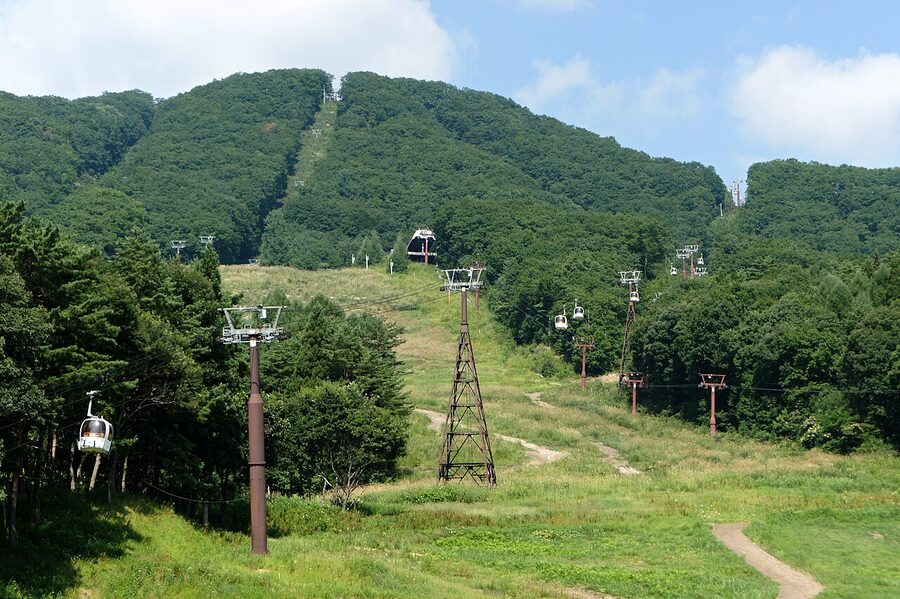 Hakuba Iwatake summit in summer with panoramic view of Northern Alps