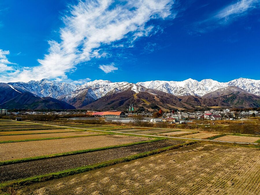 Panoramic view of Northern Alps from Tenjinzaka in Hakuba with mountains and valley