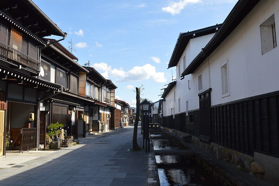 Seto canal with white-walled warehouses and koi in Hida Furukawa
