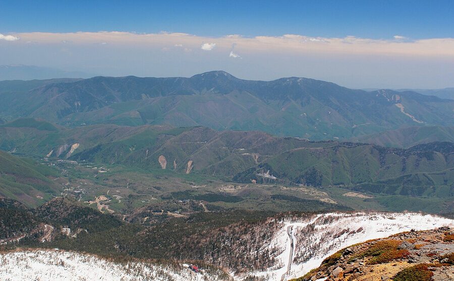View from the summit area of Mount Norikura looking down over the plateau