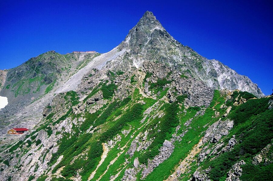 The summit spire of Mount Yari rising from the surrounding ridge, Hida Mountains