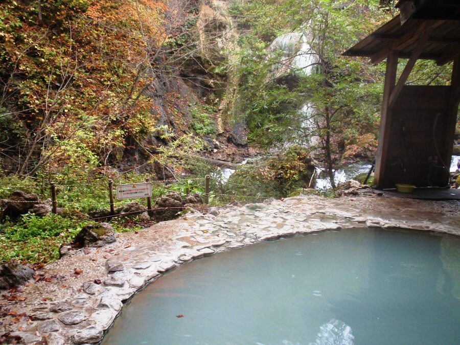 Shirahone Onsen public outdoor bath with distinctive milky white water