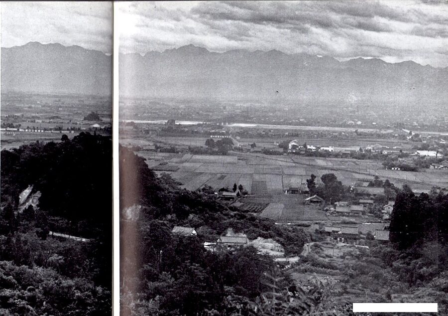 Toyama city with the Tateyama mountains rising behind, photograph from 1956