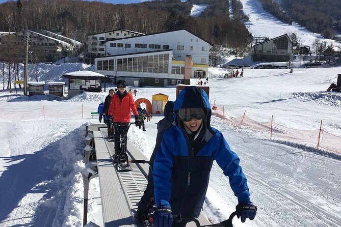 1-Day Snow Monkeys & Snow Fun in Shiga Kogen Tour - Morning at Shiga Kogen: sleds, snow bikes, and snow scooters