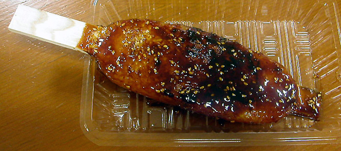 Gohei mochi rice cakes grilled on bamboo skewers
