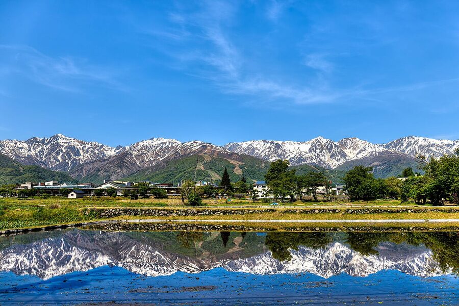 Reflection of Hakuba Sanzan and Goryu in still water