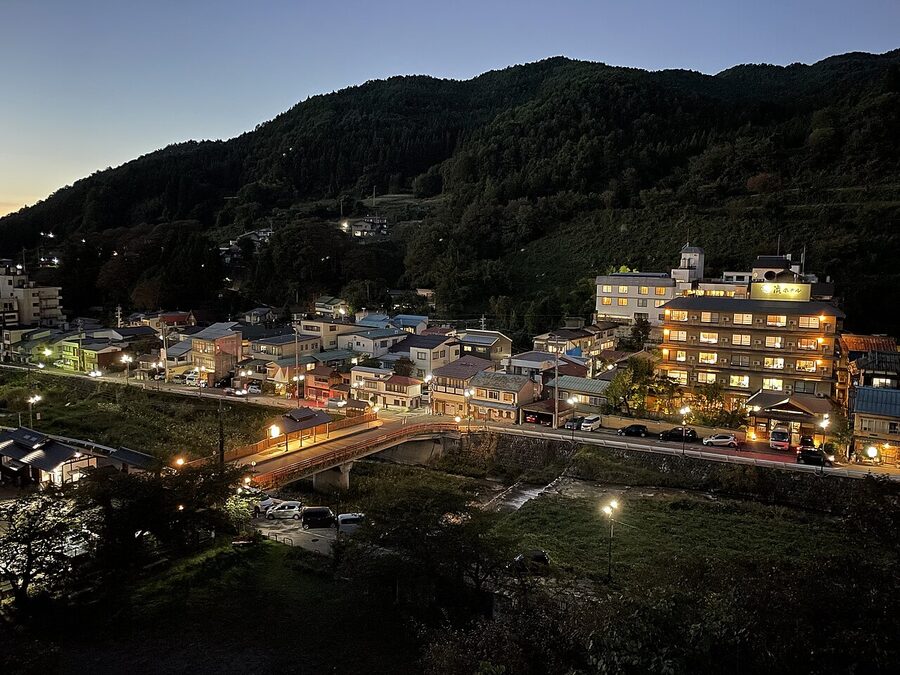 Shibu Onsen at night with traditional buildings and lanterns
