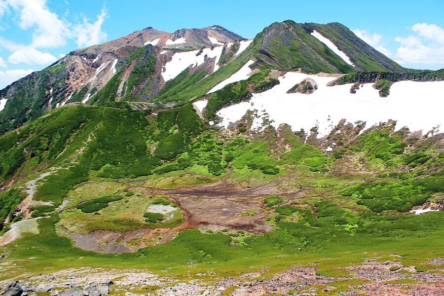 Mt Ontake's twin peaks reflected in a high alpine lake