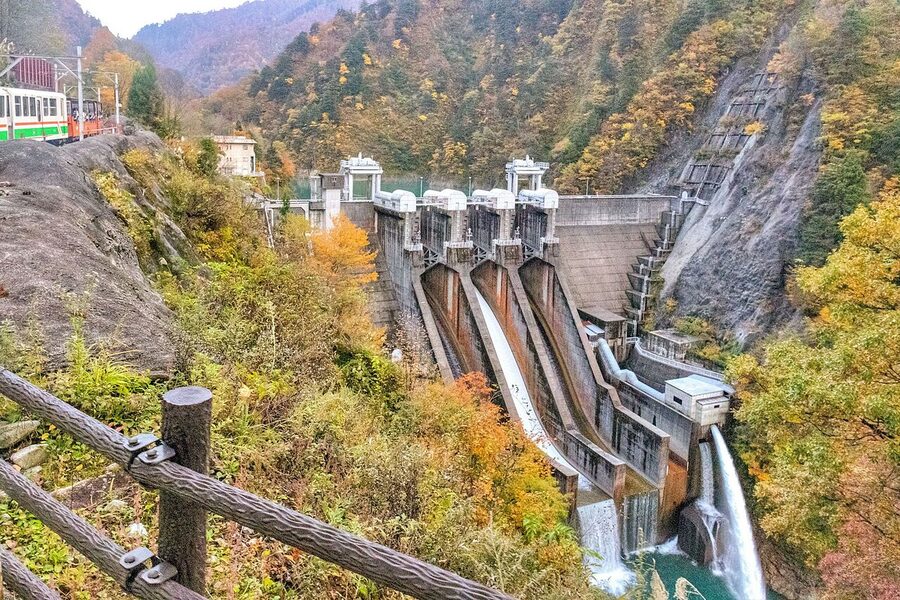 Kurobe Gorge cliffs and river in autumn from the railway