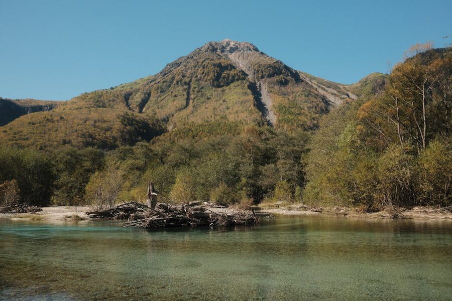 Mount Hotaka over Kamikochi waters and forest