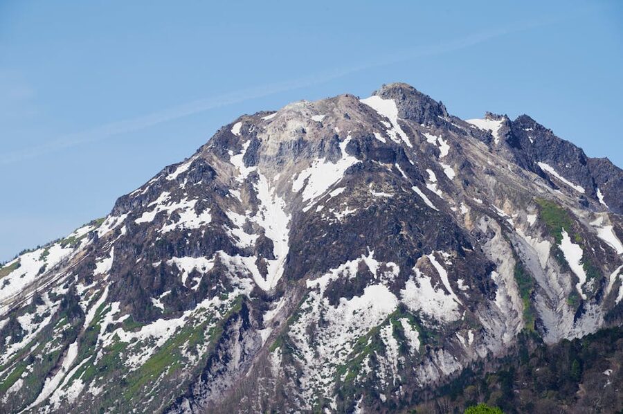 Snow-covered Mount Norikura summit ridge in Nagano
