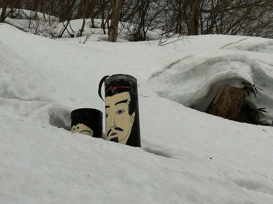 Dosojin statue in snow at Nozawa Onsen