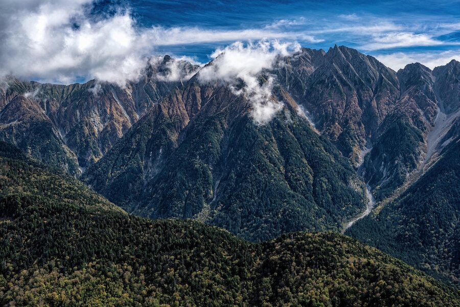 Hotaka mountain range with autumn forest in the foreground