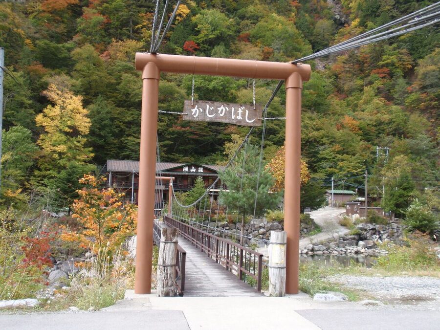 Exterior of a Shin-Hotaka ryokan beside the river