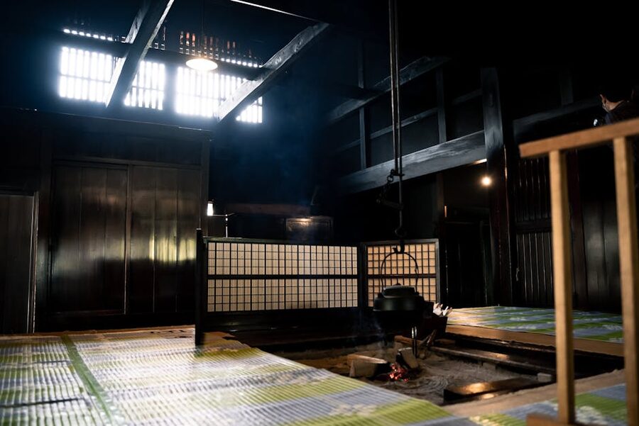 Iron cauldron hanging over an irori hearth in a Japanese farmhouse