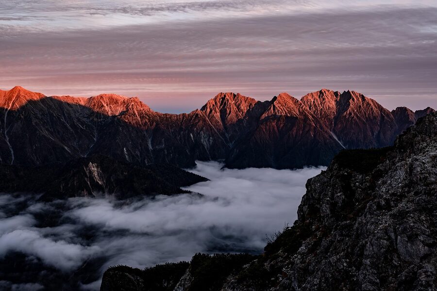 Mount Hotaka above sea of clouds at sunset in late autumn
