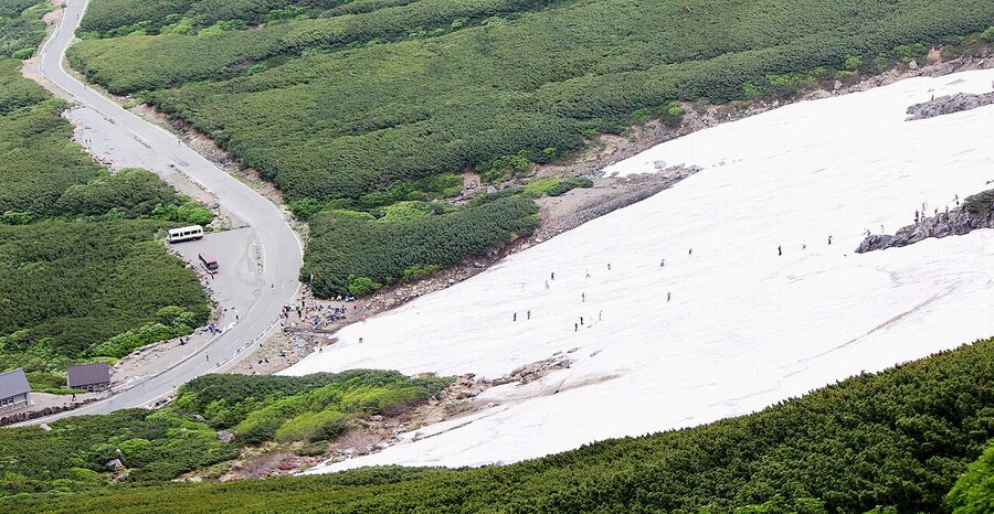 Summer skiing on the great snowfield of Mount Norikura