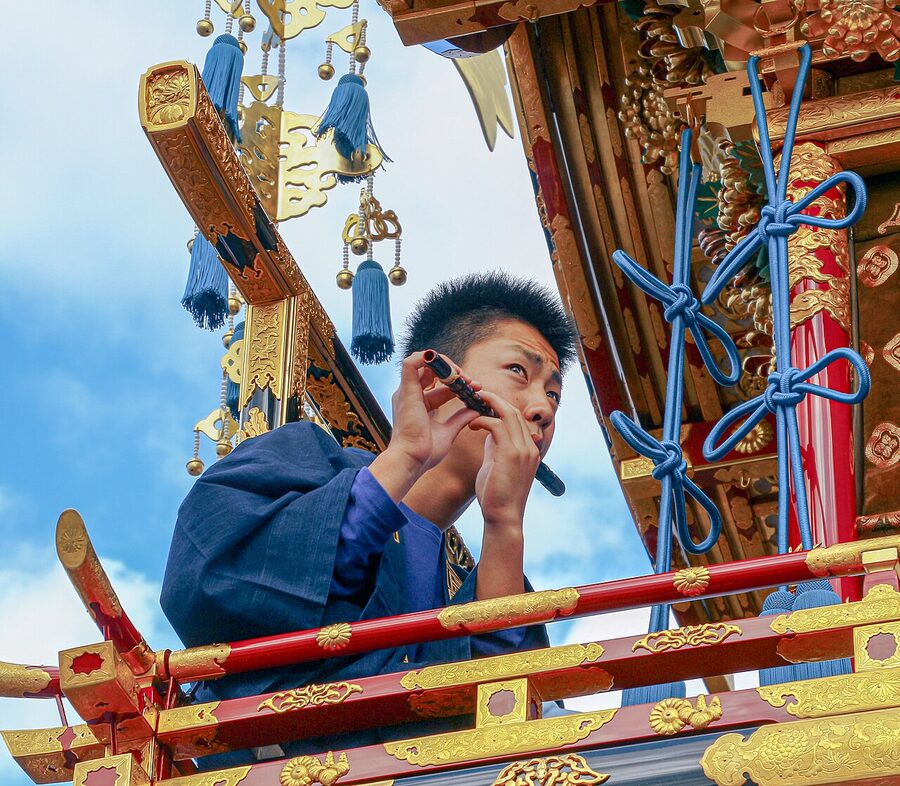 Festival musician playing flute at Takayama Matsuri