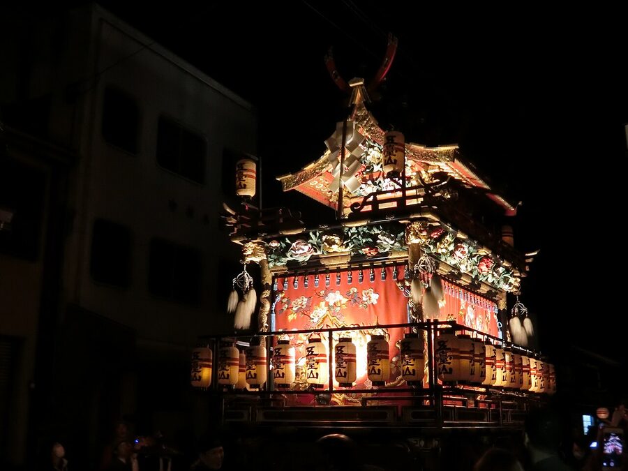 Night procession at Takayama Festival with lantern-lit yatai