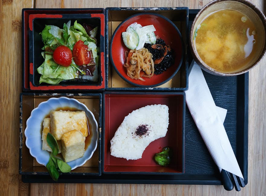 Traditional Japanese breakfast tray with miso soup and small dishes
