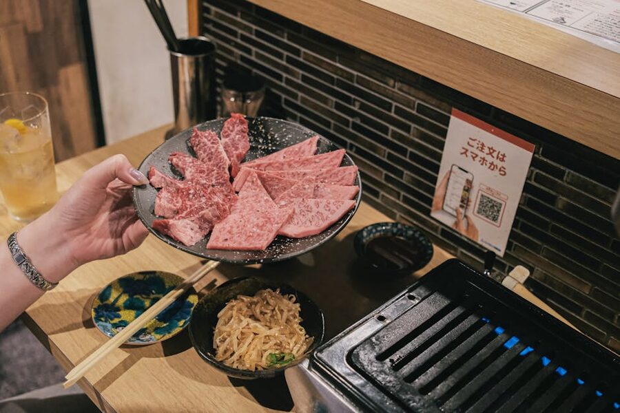 Premium wagyu beef slices on a counter ready for grilling