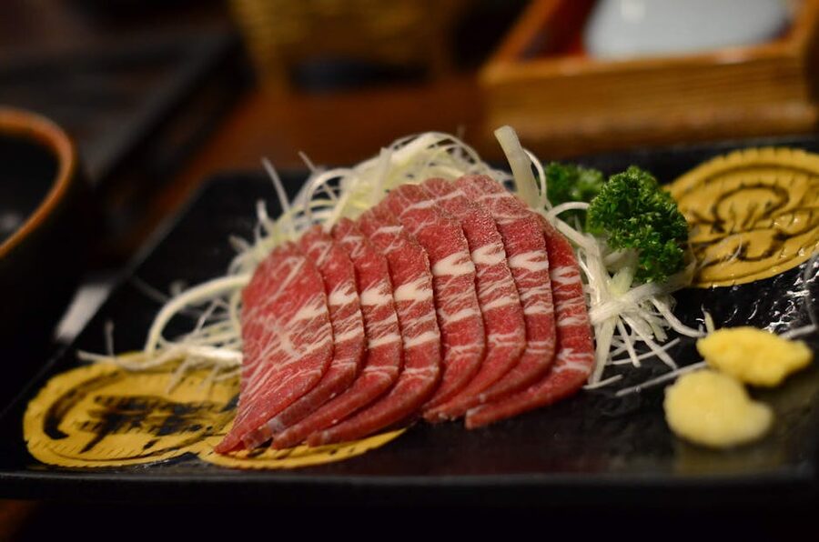 Sliced wagyu in a Japanese restaurant setting