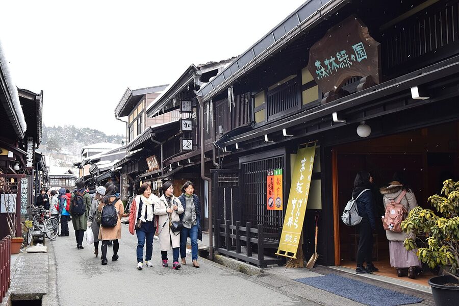 Shop curtains hanging across a Hida Takayama old town street