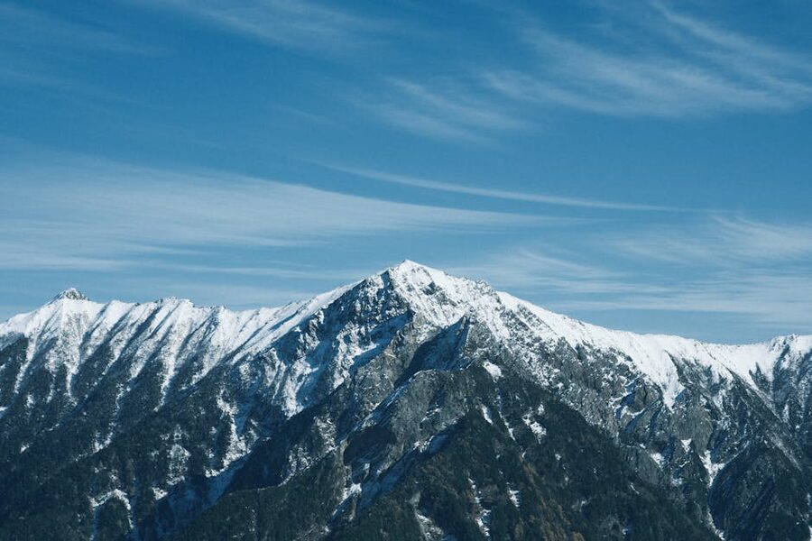 Snow-capped Tateyama peaks under blue sky