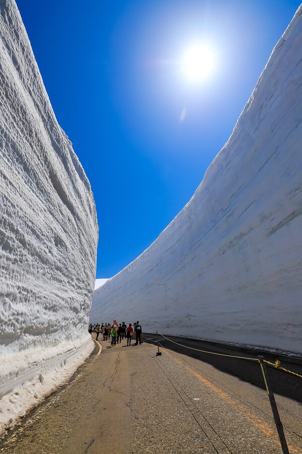Yuki-no-Otani snow corridor with visitors at Murodo