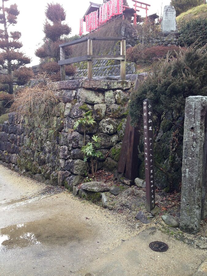 Wooden Nakasendo marker pole in Tsumago