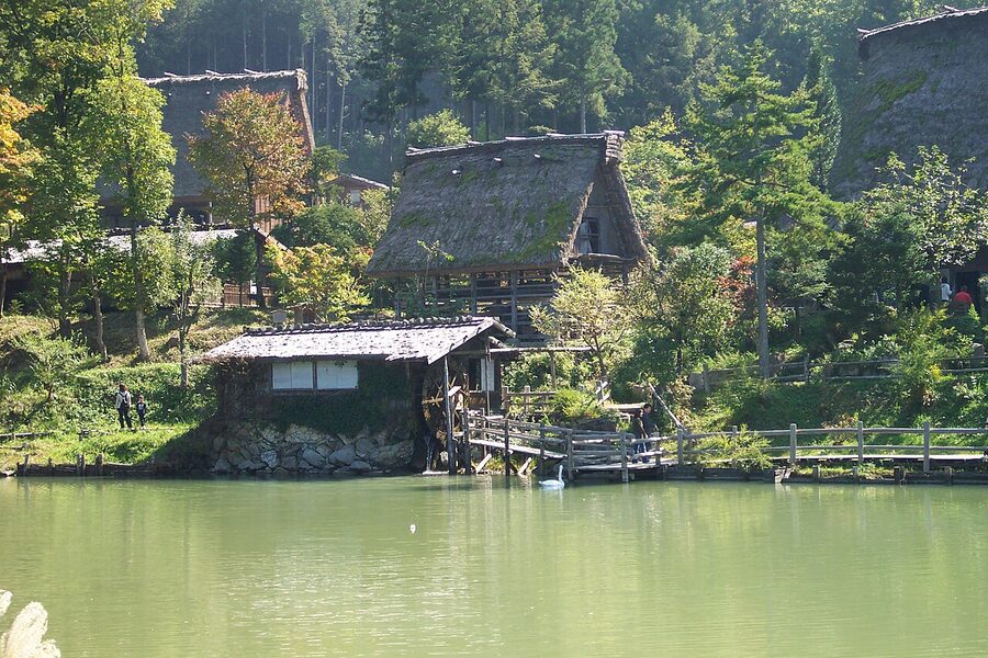 Reflection of gassho-zukuri farmhouse in the Goami pond at Hida Folk Village