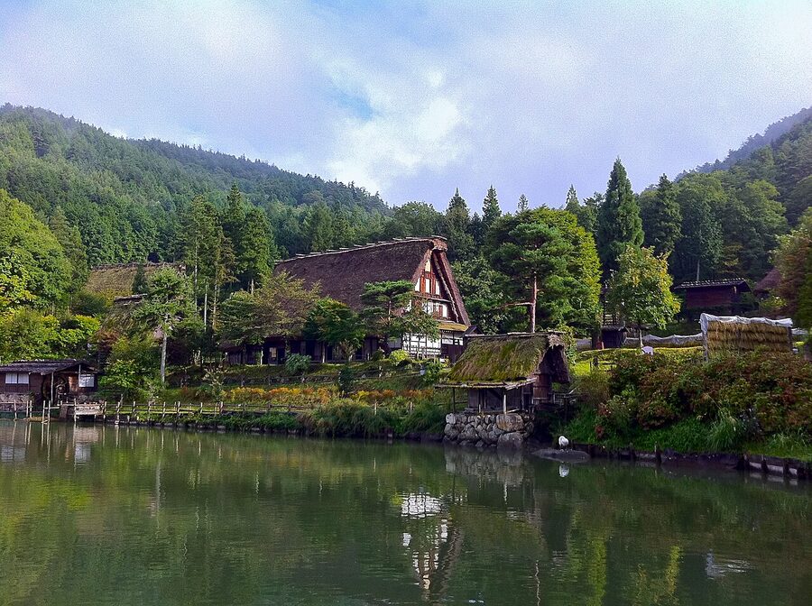 Gassho-zukuri farmhouses around the central pond at Hida Folk Village, Takayama
