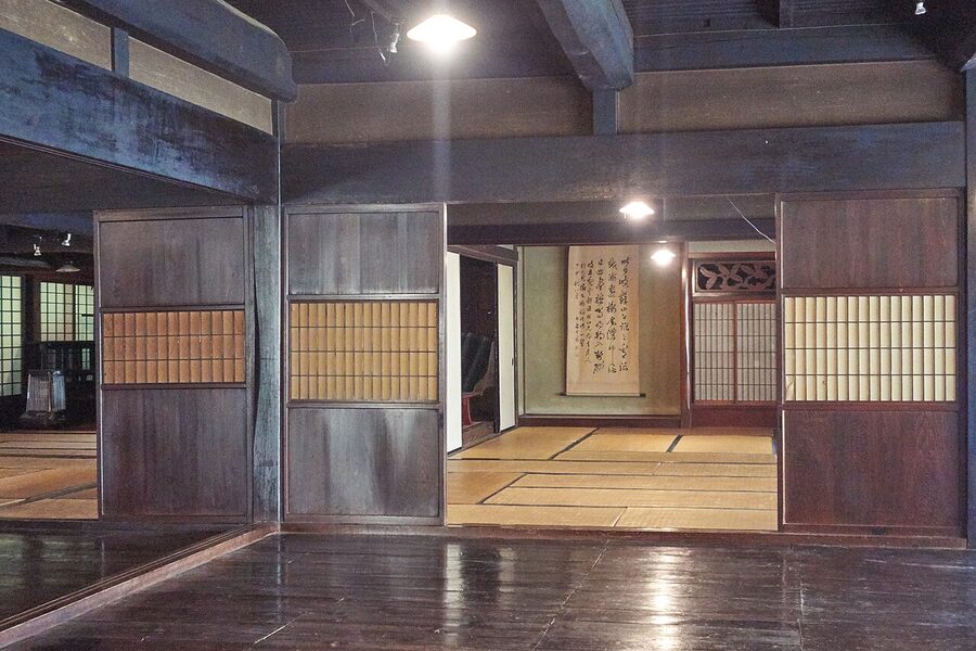 Taguchi house interior at Hida Folk Village showing tatami and dark timber