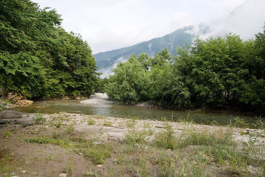 The Azusa River winding through the Yarisawa valley with Yarigatake in the distance