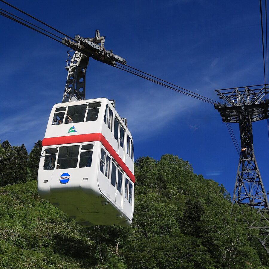 The Shinhotaka double-decker ropeway cabin climbing toward Nishi-Hotakaguchi